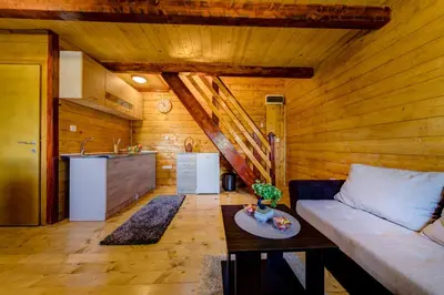 a living room with a couch and a table at Green Hill in Virpazar