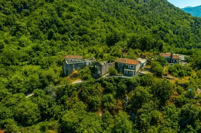 an aerial view of a house on a mountain at Green Hill in Virpazar
