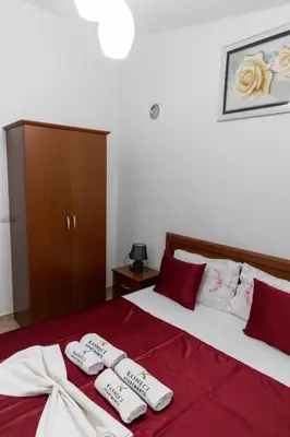 a bedroom with two beds with towels on them at Kasneci Apartments in Ulcinj