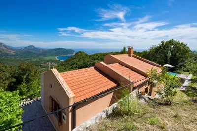 a house on a hill with a view at Villa Robinson in Petrovac na Moru