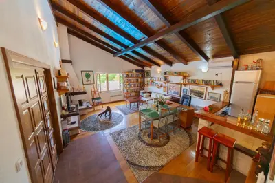 an overhead view of a living room with a table and a kitchen at Villa Robinson in Petrovac na Moru