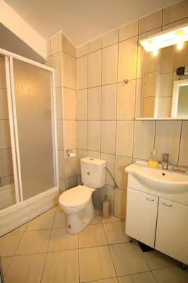 a bathroom with a toilet and a sink at Lux Pržno View Penthouse in Budva