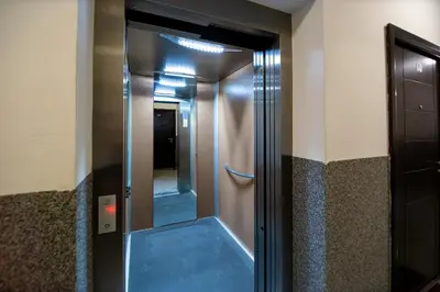 an elevator in a building with a glass door at Lux View in Budva