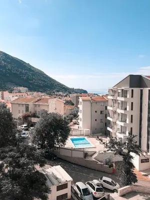 a view of a city with a pool and buildings at Lux View in Budva