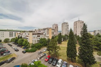 an aerial view of a parking lot in a city at Renta stan apartman odmor in Podgorica