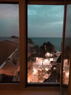 a view of a city from a window at Lux View in Petrovac na Moru