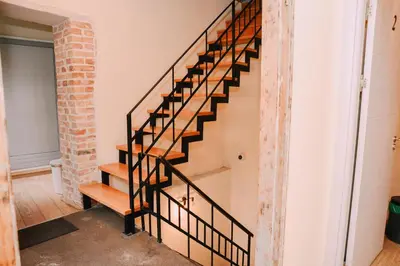 a staircase in a room with a brick wall at Step to Kotor bay Guesthouse in Kotor