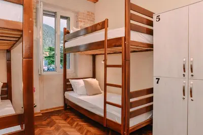 a bunk bed in a room with a bunk bed in a hostel at Step to Kotor bay Guesthouse in Kotor