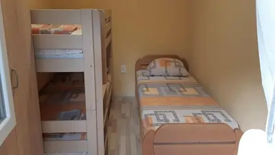 a small room with two bunk beds in it at Apartment Sali in Kotor