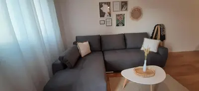 a living room with a couch and a table at Lux Apartment PortoVista in Bar