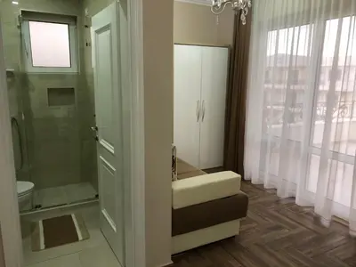 a bathroom with a shower and a toilet and a sink at METROPOLIS in Ulcinj