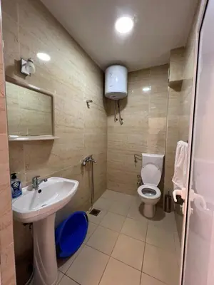 a bathroom with a sink and a toilet at Kontiki Apartments in Ulcinj