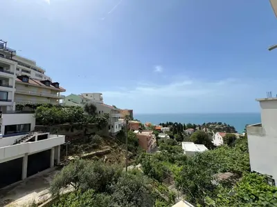 a view of a city with buildings and the ocean at Kontiki Apartments in Ulcinj