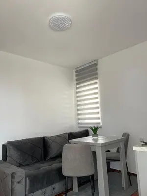 a living room with a couch and a table at Kontiki Apartments in Ulcinj