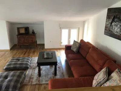 a living room with a couch and a coffee table at Green Silence - Anja in Danilovgrad