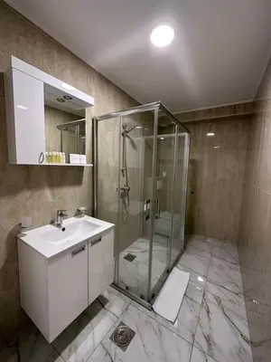 a bathroom with a shower and a sink at Hotel MonteNino in Bar