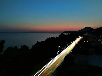 a night view of a road with cars at Hotel MonteNino in Bar