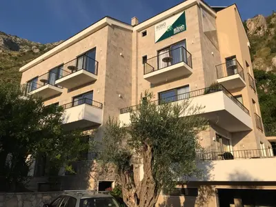 a building with a car parked in front of it at REZEVICI BOUTIQUE VILLA in Petrovac na Moru