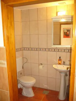 a bathroom with a toilet and a sink at MARINOVIC APARTMENTS in Budva