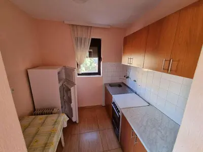 a small kitchen with a sink and a refrigerator at Дом для семейного отдыха в Утехе, Черногория in Utjeha