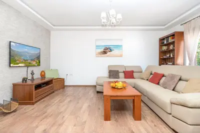 a living room with a couch and a table at Seafoam apartment in Kotor