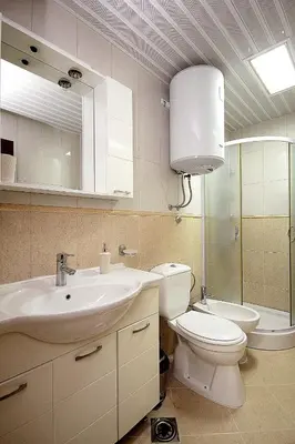 a bathroom with a sink and a toilet and a mirror at Holiday apartments Petrovac in Petrovac na Moru