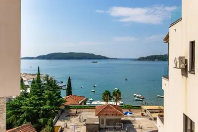 a view of a body of water from a building at Apartment with sea view BEATRICE#26 in Rafailovici