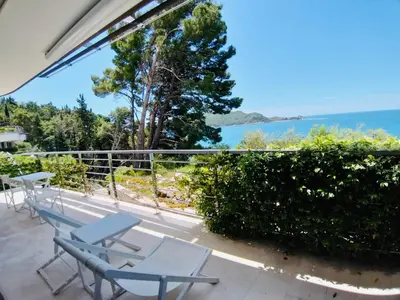 a balcony with chairs and a view of the ocean at Sea View Villas in Duklei in Budva