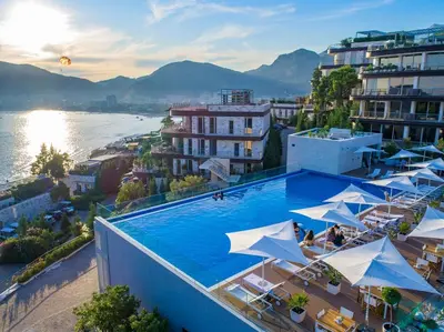 a view of a hotel pool with umbrellas at Sea View Villas in Duklei in Budva