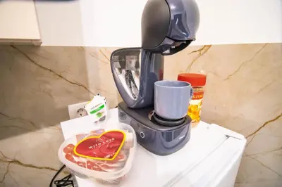 a coffee maker sitting on top of a counter at Simo apartments airport Podgorica in Podgorica
