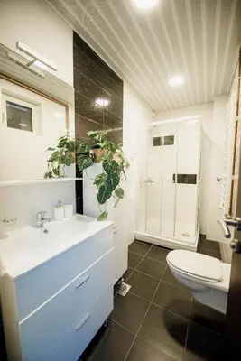 a bathroom with a white sink and a toilet at Villa Danigo in Budva