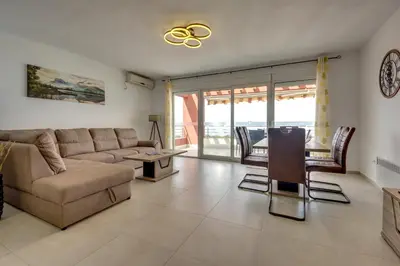a living room with a couch and a table at Montenegro Apartments Utjeha in Utjeha