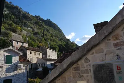 a view of a village with a mountain at Apartment Antonia in Kotor