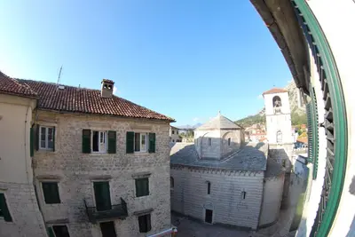 a view of an old building and a clock tower at Apartment Antonia in Kotor