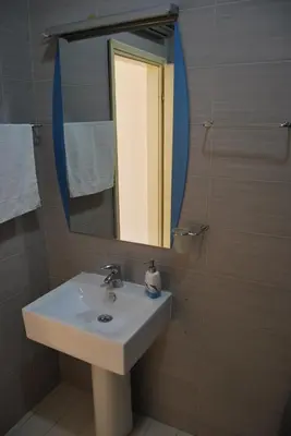 a bathroom with a sink and a mirror at Apartment Antonia in Kotor