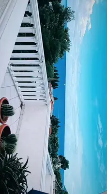 a view of the side of a building with a swimming pool at Joksimović apartmani in Bar, Susanj
