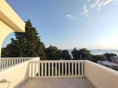 a balcony with a view of the ocean at Joksimović apartmani in Bar, Susanj
