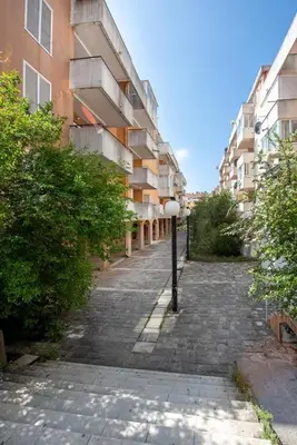 an empty street next to a tall building at Adok stan in Budva