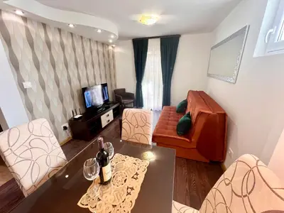 a small living room with a couch and a table at Guesthouse Civovic in Bar