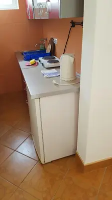 a kitchen counter with a white counter top at Studios Velika Plaža in Ulcinj