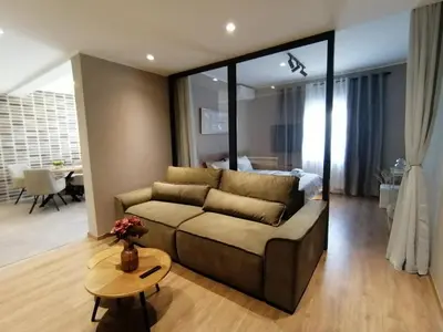 a living room with a couch and a table at Apartments Knežević in Ulcinj