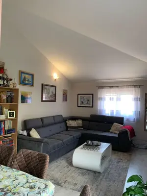 a living room with a couch and a table at Guest House Mudresa in Budva