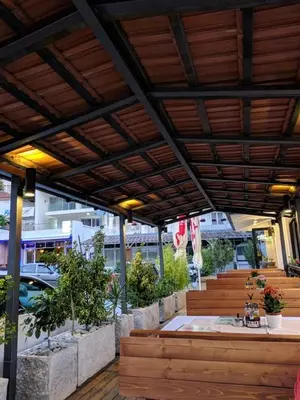 an outdoor patio with a sink and plants at Bella Vista B&B in Ulcinj