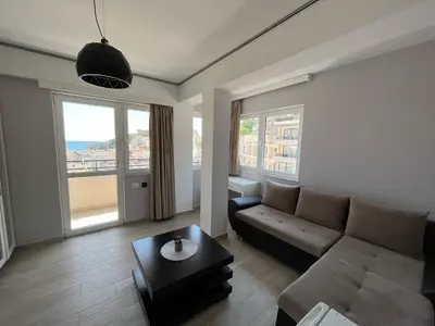 a living room with a couch and a table at Bella Vista B&B in Ulcinj