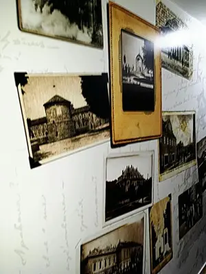 a wall with pictures of cities and buildings at Apartments Bokan in Cetinje