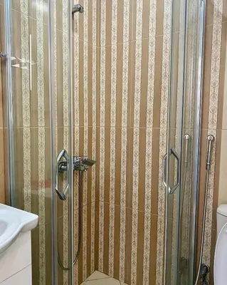 a shower with a glass door in a bathroom at Fimi Apartments in Ulcinj