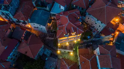 an overhead view of a city at night at Villa Dulcinea in Ulcinj