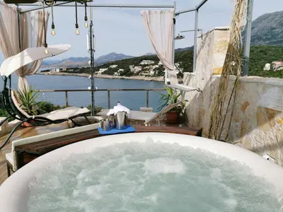 a bath tub with water in it with a view at House Carpe Diem with the best sea view in Masline