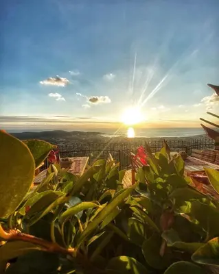 a view of the sun setting over the ocean at Ranc Mujica in Bar