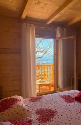 a bedroom with a bed and a window with a view at Ranc Mujica in Bar